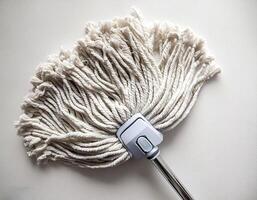 Top of view one mop on the white background photo