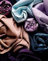 Colorful plain fabric texture with creative, smooth and crumpled or shabby patterns as background photo