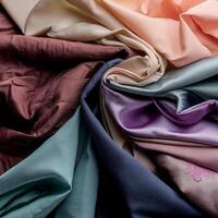Colorful plain fabric texture with creative, smooth and crumpled or shabby patterns as background photo