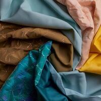 Colorful plain fabric texture with creative, smooth and crumpled or shabby patterns as background photo