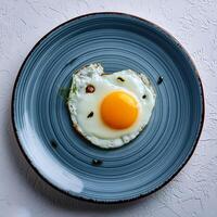 Creative food concept. Top view image of single and only perfect sunny side up egg. photo