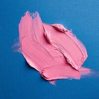 Abstract pink oil paint texture on blue canvas or wall. Minimalistic background with copy space. photo