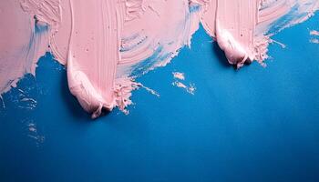 Abstract pink oil paint texture on blue canvas or wall. Minimalistic background with copy space. photo