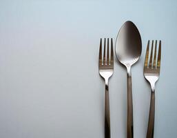 spoon and fork kept on white background. ready to eat concept. flat lay background concept photo