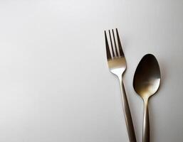 spoon and fork kept on white background. ready to eat concept. flat lay background concept photo