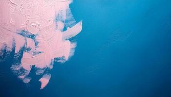 Abstract pink oil paint texture on blue canvas or wall. Minimalistic background with copy space. photo