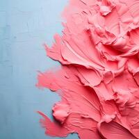 Abstract pink oil paint texture on blue canvas or wall. Minimalistic background with copy space. photo