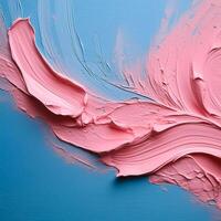 Abstract pink oil paint texture on blue canvas or wall. Minimalistic background with copy space. photo