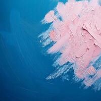 Abstract pink oil paint texture on blue canvas or wall. Minimalistic background with copy space. photo
