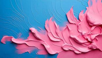 Abstract pink oil paint texture on blue canvas or wall. Minimalistic background with copy space. photo