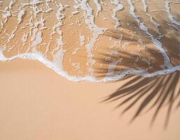 empty abstract sand beach with palm leaf shadow and transparent water wave from above, blank background banner for travel, vacation and wellbeing with copy space. top of views, aerial views. photo