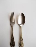 spoon and fork kept on white background. ready to eat concept. flat lay background concept photo