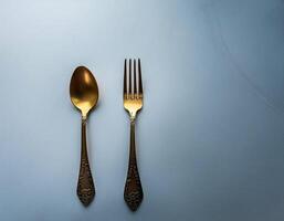 spoon and fork kept on white background. ready to eat concept. flat lay background concept photo