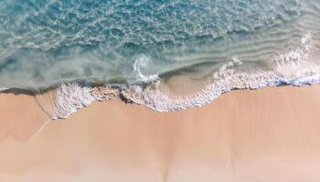 empty abstract sand beach with palm leaf shadow and transparent water wave from above, blank background banner for travel, vacation and wellbeing with copy space. top of views, aerial views. photo