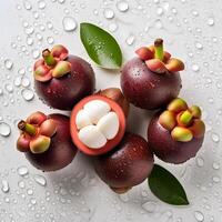 Creative food concept. Fresh a pile of Top view of half ripe Mangosteen with leaves. photo