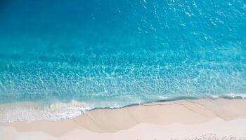 empty abstract sand beach with palm leaf shadow and transparent water wave from above, blank background banner for travel, vacation and wellbeing with copy space. top of views, aerial views. photo