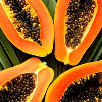 Whole and half of ripe papaya fruit. pattern texture background. photo