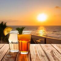 drinks with blur beach and sunset in background. concept of leisure, holiday, relaxation photo