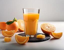 Glass of Orange juice with orange sacs and slices fruits isolate on white background photo
