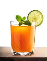 tropical drink concept. Orange cocktail with lime garnish. photo