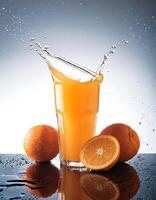 Glass of Orange juice with orange sacs and slices fruits isolate on white background photo