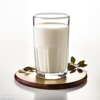 Glass of milk on white background photo
