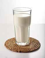 Glass of milk on white background photo