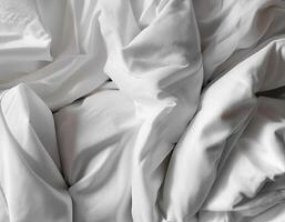 Background concept. Soft bed sheets that are still wrinkled after being used. The white bed sheets were crumpled and shabby. Pattern texture background. photo