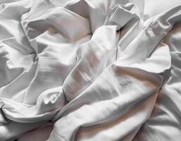 Background concept. Soft bed sheets that are still wrinkled after being used. The white bed sheets were crumpled and shabby. Pattern texture background. photo
