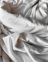 Background concept. Soft bed sheets that are still wrinkled after being used. The white bed sheets were crumpled and shabby. Pattern texture background. photo