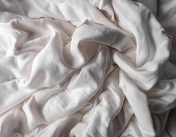 Background concept. Blankets that are still wrinkled have been used. The white blanket is crumpled and shabby. Pattern texture background photo