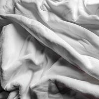 Background concept. Blankets that are still wrinkled have been used. The white blanket is crumpled and shabby. Pattern texture background photo