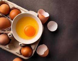 photo pallet with eggs and raw broken egg with yolk. Pattern texture background