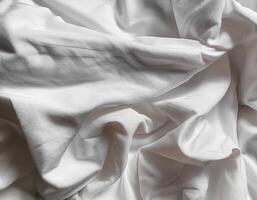 Background concept. Soft bed sheets that are still wrinkled after being used. The white bed sheets were crumpled and shabby. Pattern texture background. photo