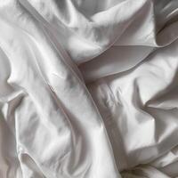 Background concept. Soft bed sheets that are still wrinkled after being used. The white bed sheets were crumpled and shabby. Pattern texture background. photo