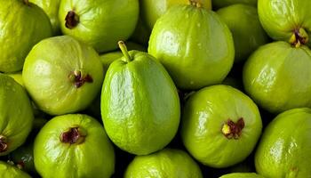 a pile of close-up guava fruit fresh, organic. photo
