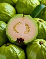 a pile of close-up guava fruit fresh, organic. photo