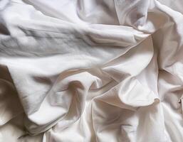Background concept. Soft bed sheets that are still wrinkled after being used. The white bed sheets were crumpled and shabby. Pattern texture background. photo