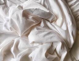 Background concept. Soft bed sheets that are still wrinkled after being used. The white bed sheets were crumpled and shabby. Pattern texture background. photo