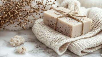 Soap Bar Resting on White Towel photo