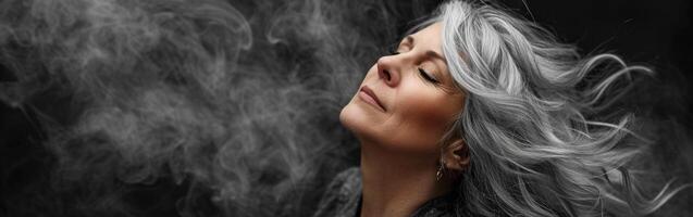 Woman With Closed Eyes Surrounded by Smoke photo