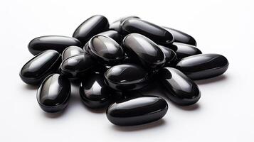 Stack of Black Pills on White Table photo
