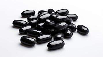 Stack of Black Pills on White Table photo