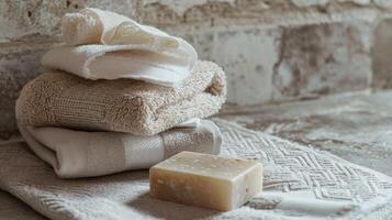 Stack of Towels and Soap on Towel photo