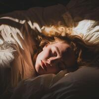 Woman Sleeping in Bed With Sunlight photo