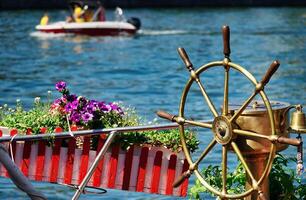 Copper colored rudder of the Touristic boat photo