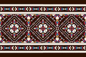 Geometric ethnic design pattern on brown background vector