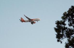 Nice, France - June 20 2024 - An easy jet flight approaches Nice, France, on a sunny day photo