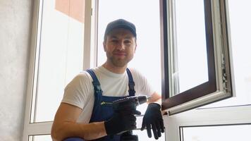 Portrait of window installer with screwdriver video
