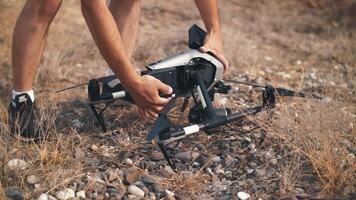 Drone with a camera in the air on the set of a movie. Drone battery replacement. Filming in the desert video